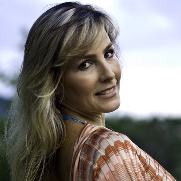 blonde woman smiling at the camera