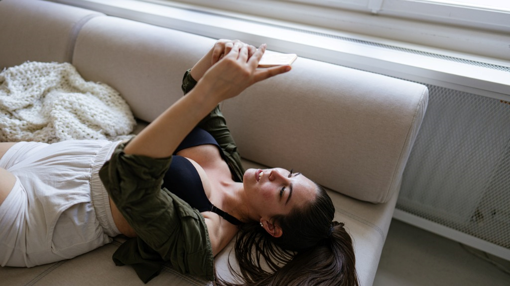 brunette young woman texting